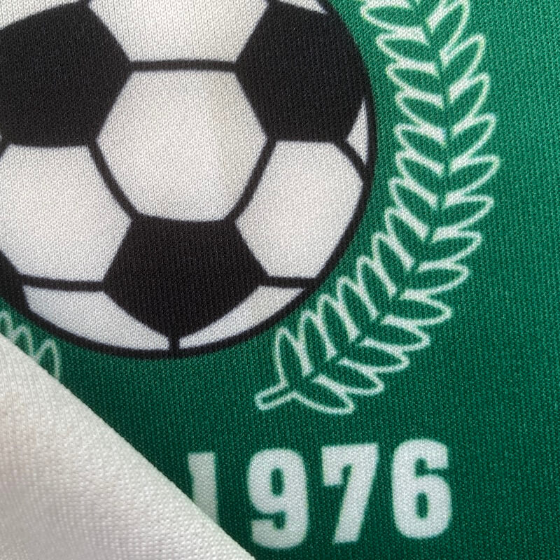 Speedo knitted polyester fabric with sublimation printing on front side and blank white on back side.