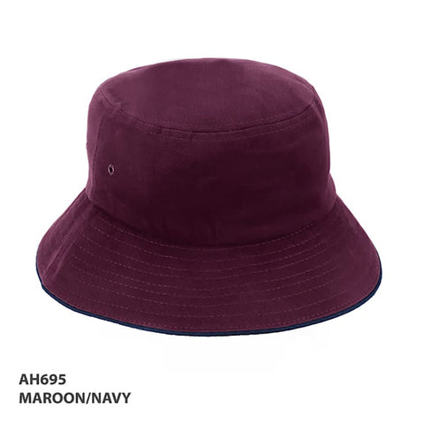 A maroon and navy bucket hat with a branding logo, featuring a wide brim and a classic design.